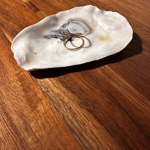 Elegant Gold Ring on Ceramic Dish